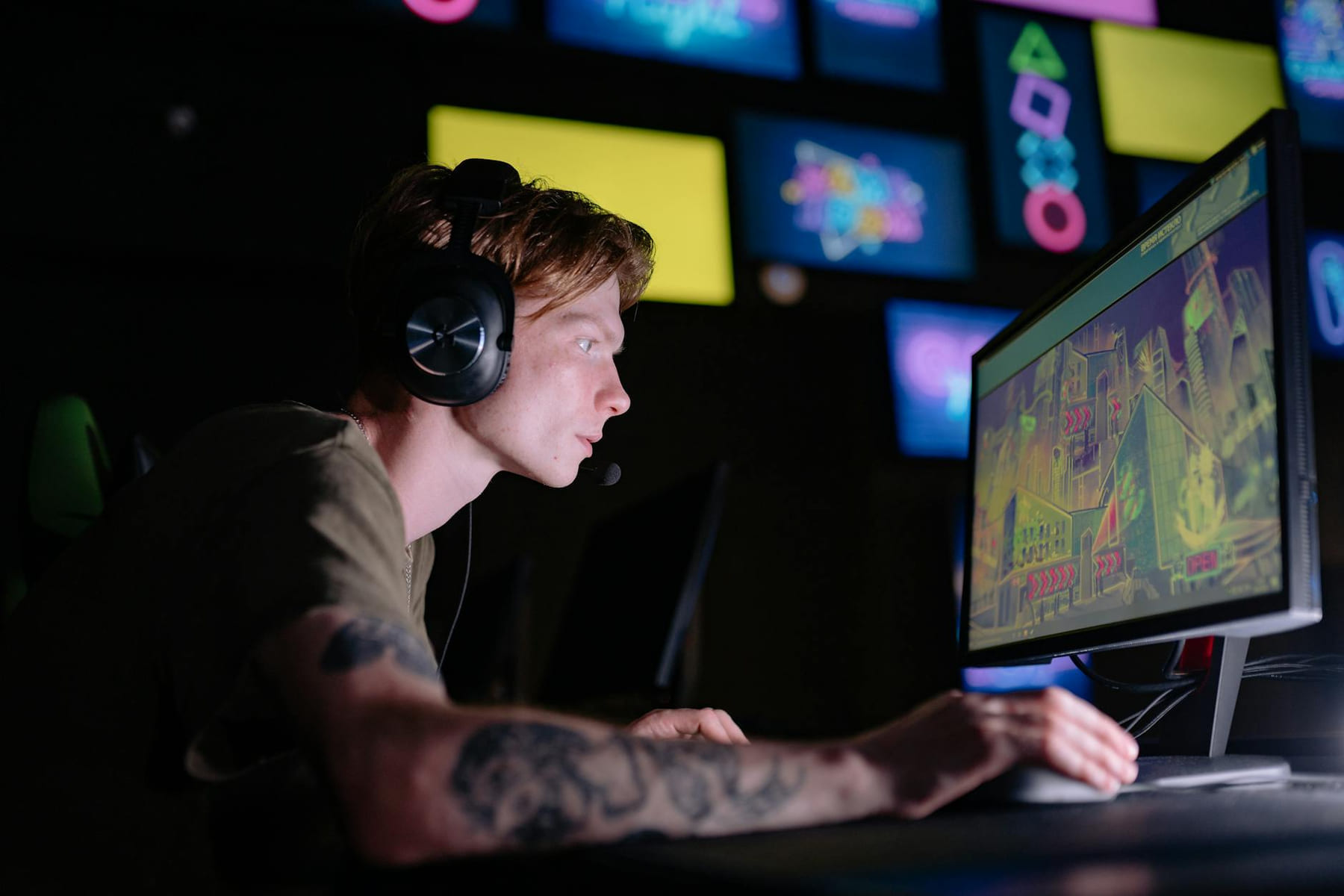 Engaged gamer wearing headphones intensely playing on a computer monitor indoors. on Quest on Chain