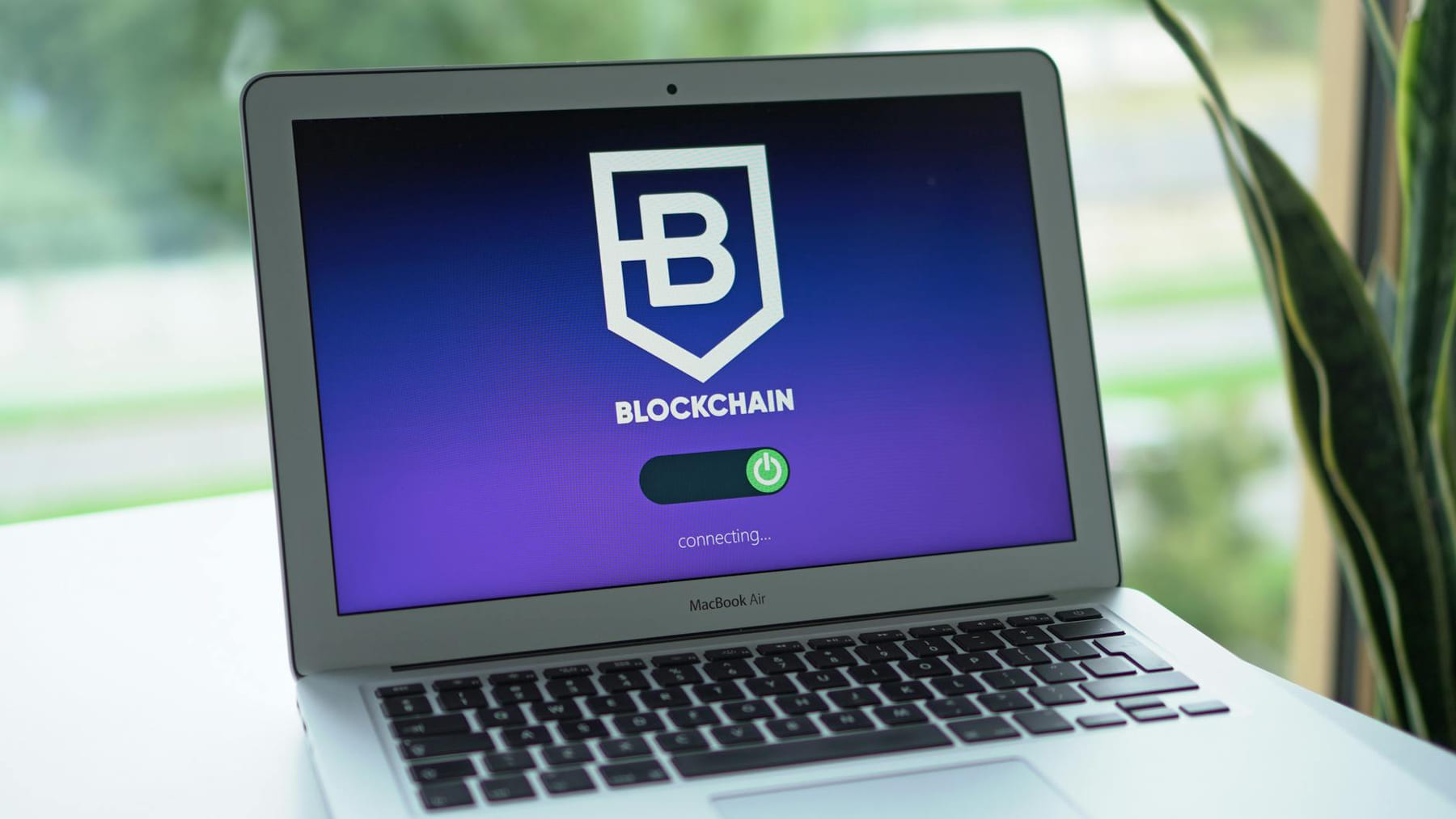A laptop screen displays a blockchain interface, highlighting digital finance technology. on Quest on Chain