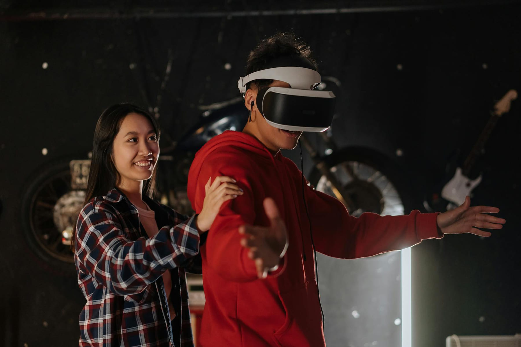 Young couple engaging in VR gaming indoors, wearing a virtual reality headset. on Quest on Chain