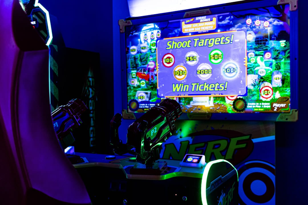 a gaming room with a big screen tv and neon lights on Quest on Chain